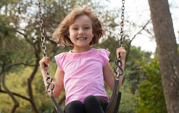 girl on swing outside